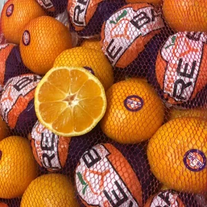 half-cut oranges and a sack of oranges