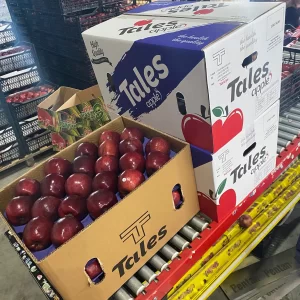 a case of red apples and boxes around it